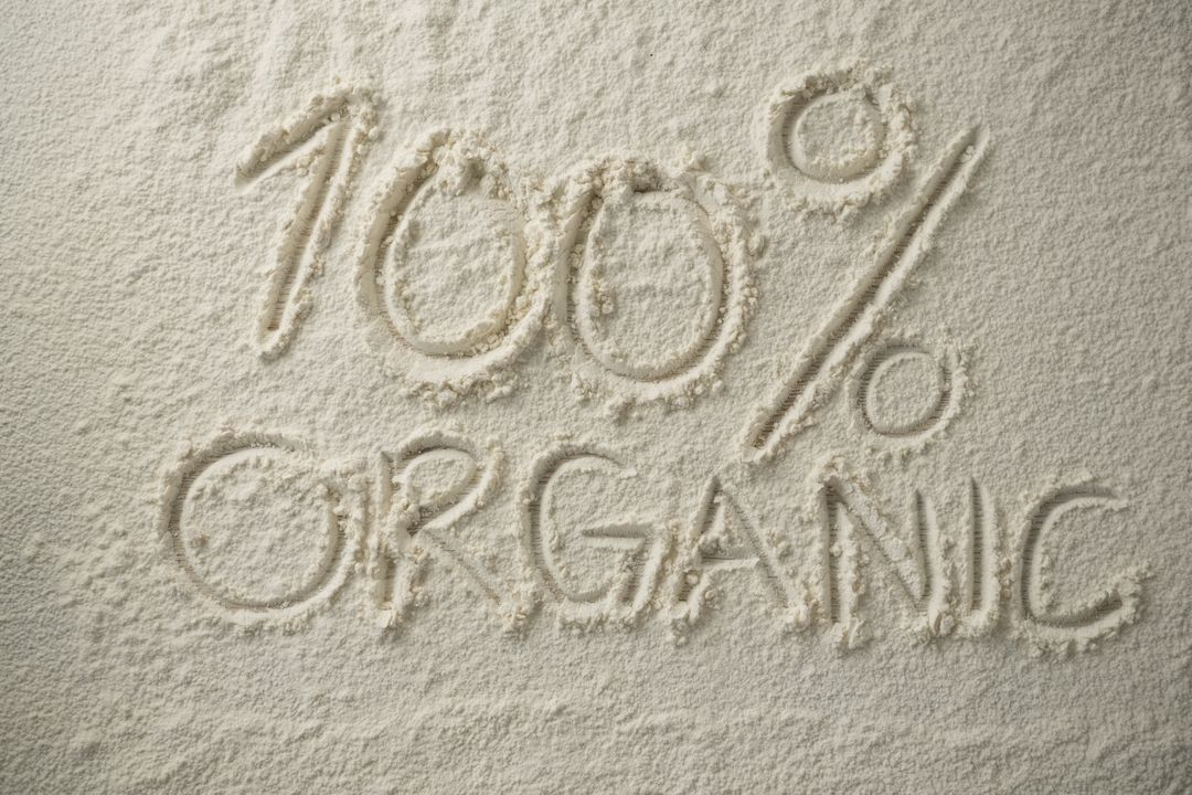 Image of sand on which is written "100% organic" - Ten powerful advertising techniques to lure customers and boost your sales - Image