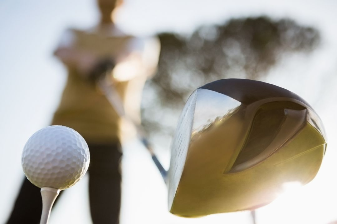 Close-up image of a man playing golf with the ball and the golf club in the center - Ten powerful advertising techniques to lure customers and boost your sales - Image