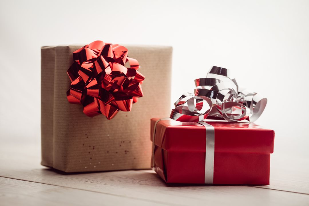 Image of two wrapped presents on a wooden ground - Ten powerful advertising techniques to lure customers and boost your sales - Image