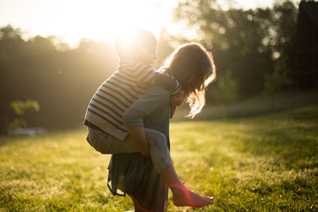 Image of a girl giving her little brother a piggyback ride - Topics and ideas for blogs that will inspire you and keep your readers engaged - Image