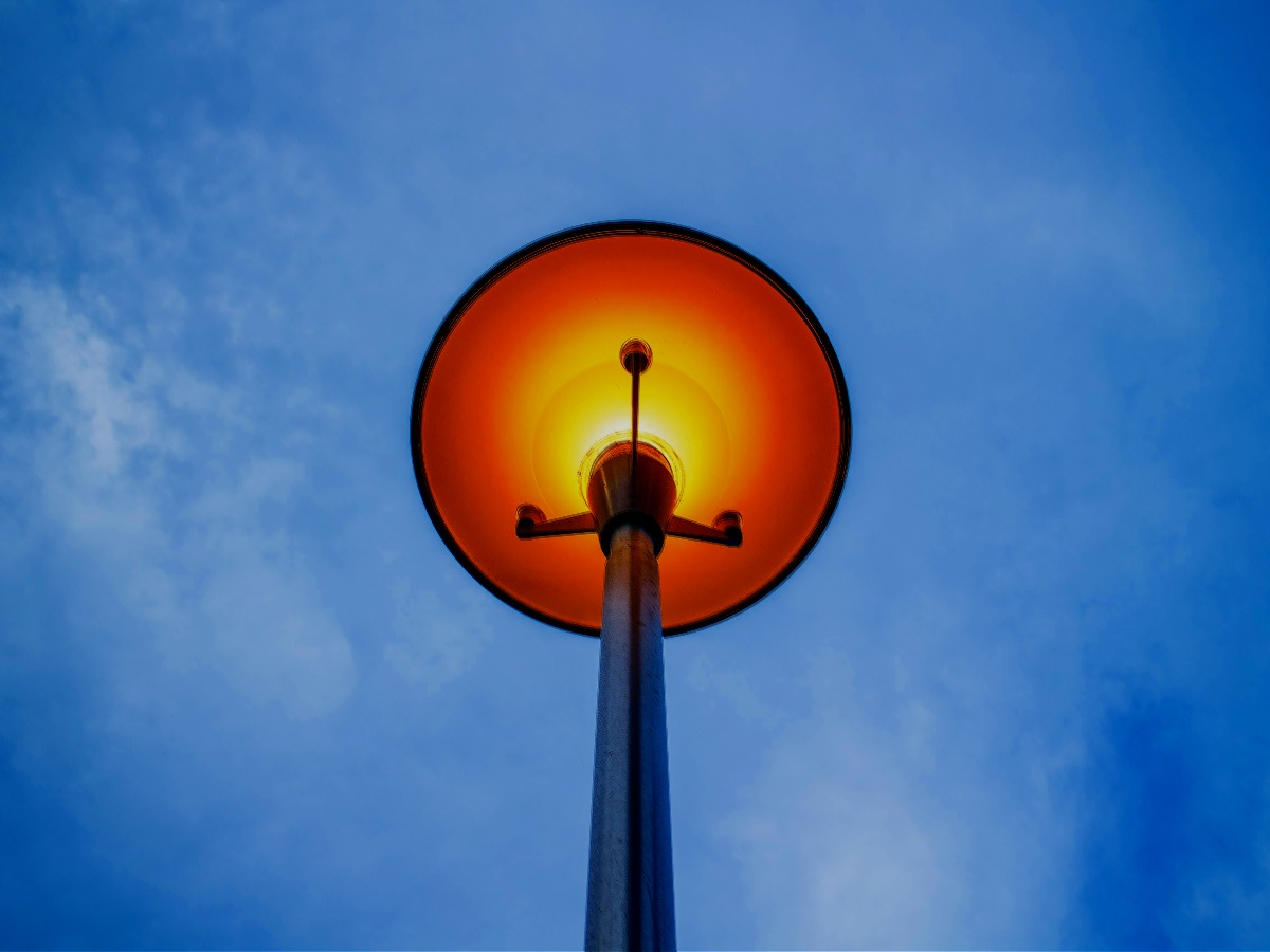 Edited image of a yellow light street lamp with a sky blue background - How to choose a good color combination for photography - Image