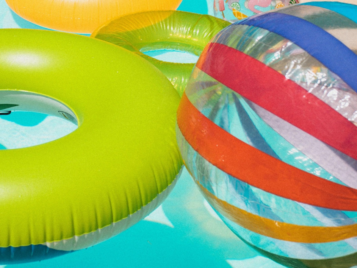 Colourful image of inflatable pool toys - red, orange, green and blue combination - How to choose a good color combination for photography - Image