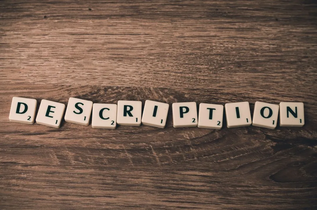 Image of "Description" written with letters on gaming pieces on a wooden underground - The beginner's guide to YouTube marketing, how to increase subscribers quickly - Image