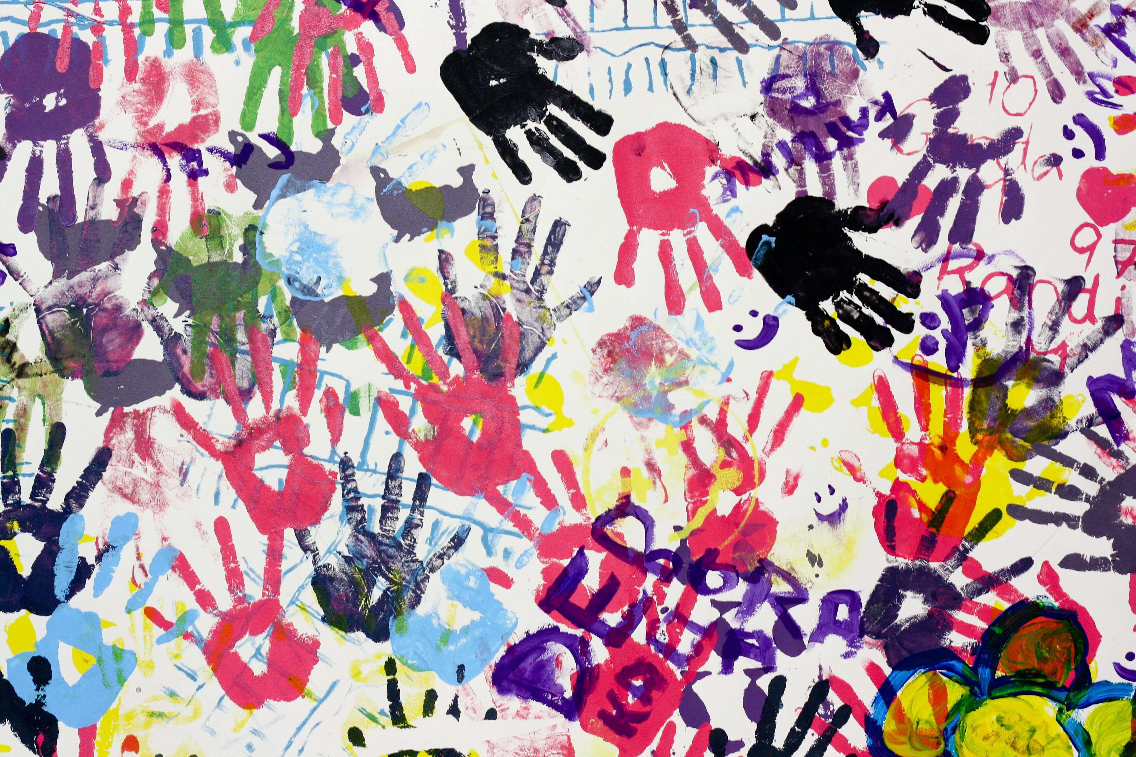 colorful handprints on a wall