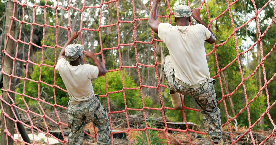 African American soldiers exhibit focus and strength in a rope
