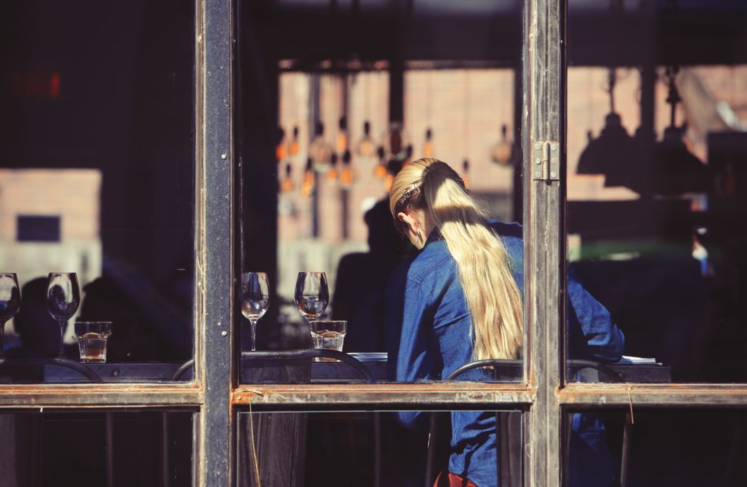 a woman sitting at a table from Pikwizard