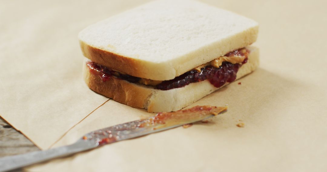 Knife and Sandwich with Bread and Peanut Butter Stock Photo