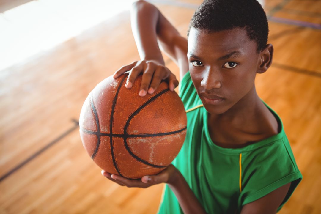 Portrait of male teenager with basketball - Free Images, Stock Photos and Pictures on Pikwizard.com