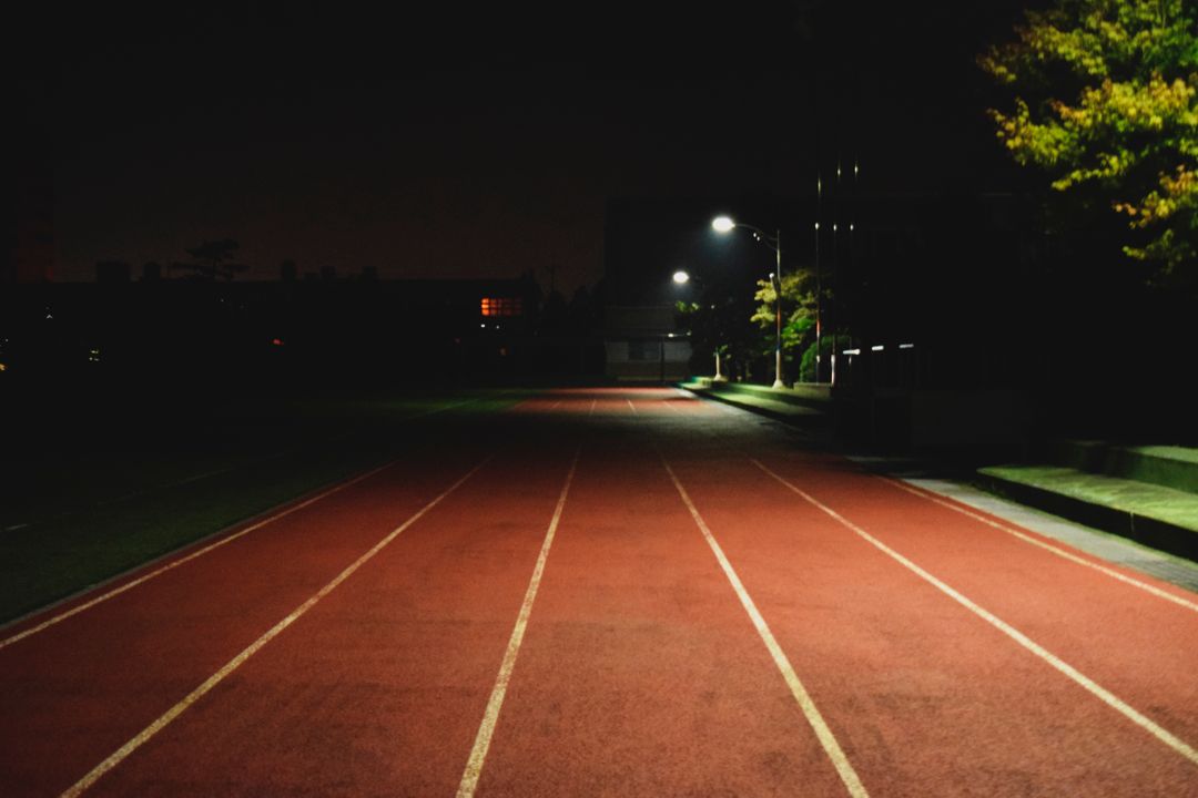 a running track at night - Free Images, Stock Photos and Pictures on Pikwizard.com