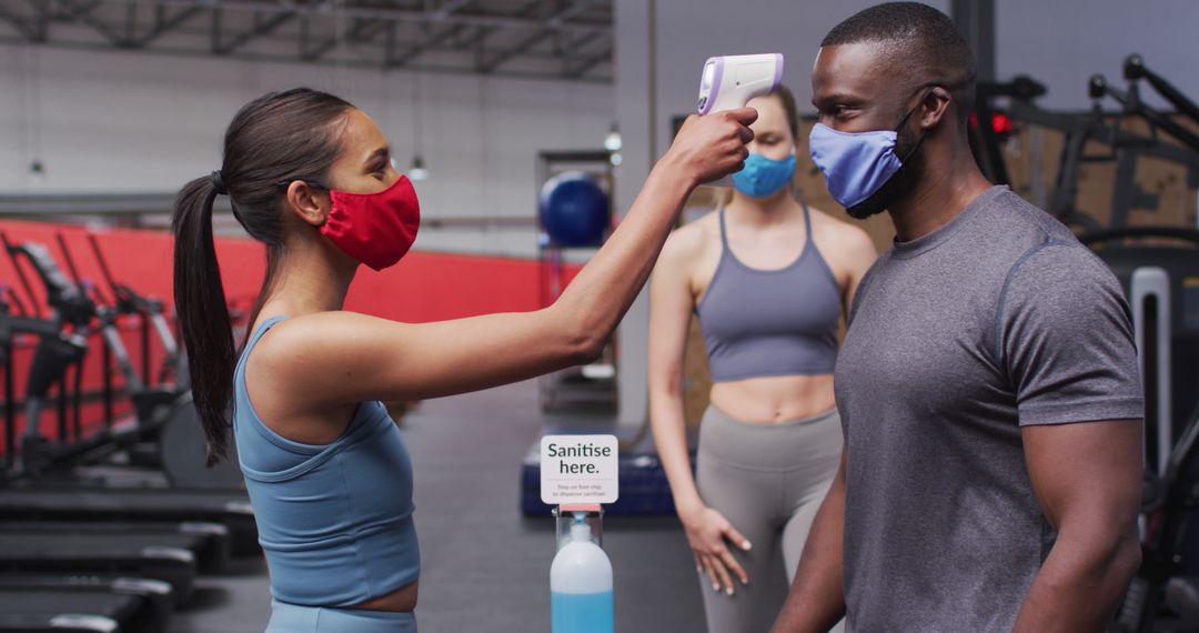 Caucasian man and african american woman dressed in activewear