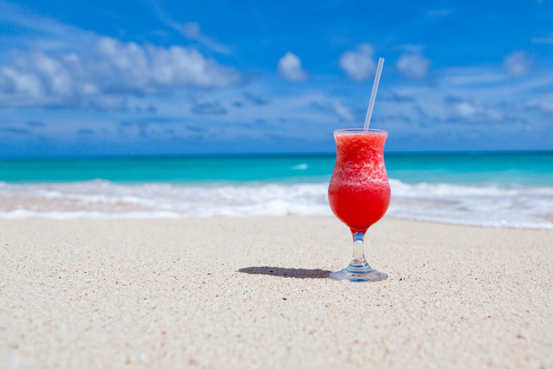 Red Slush Drink in Glass on Beach - Free Images, Stock Photos and Pictures on Pikwizard.com