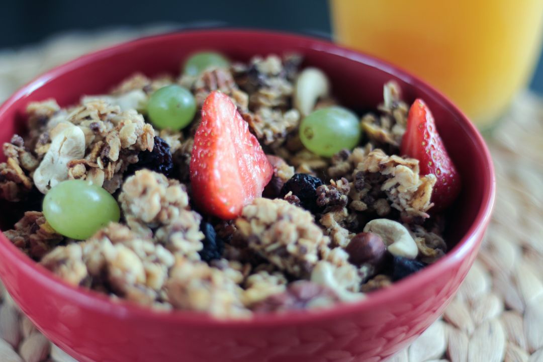 a bowl of granola with fruit - Free Images, Stock Photos and Pictures on Pikwizard.com