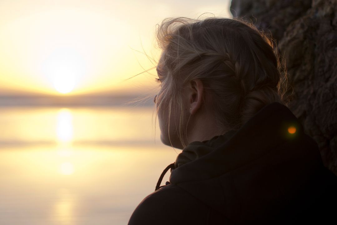 Image of a Woman Looking into the Distance at Sunset