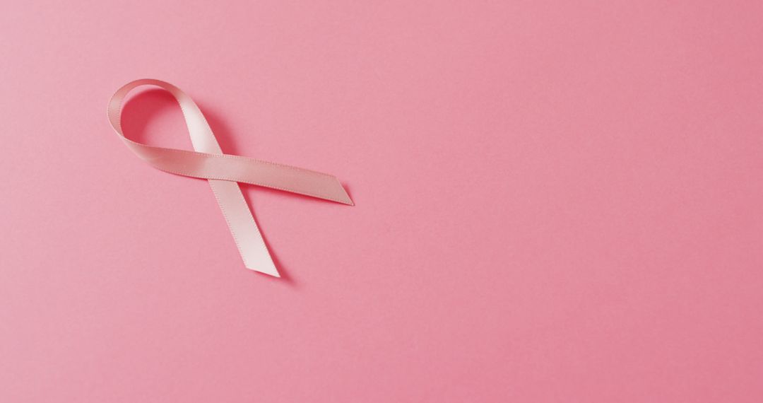 Image of pink breast cancer ribbon on pale pink background - Free Images, Stock Photos and Pictures on Pikwizard.com