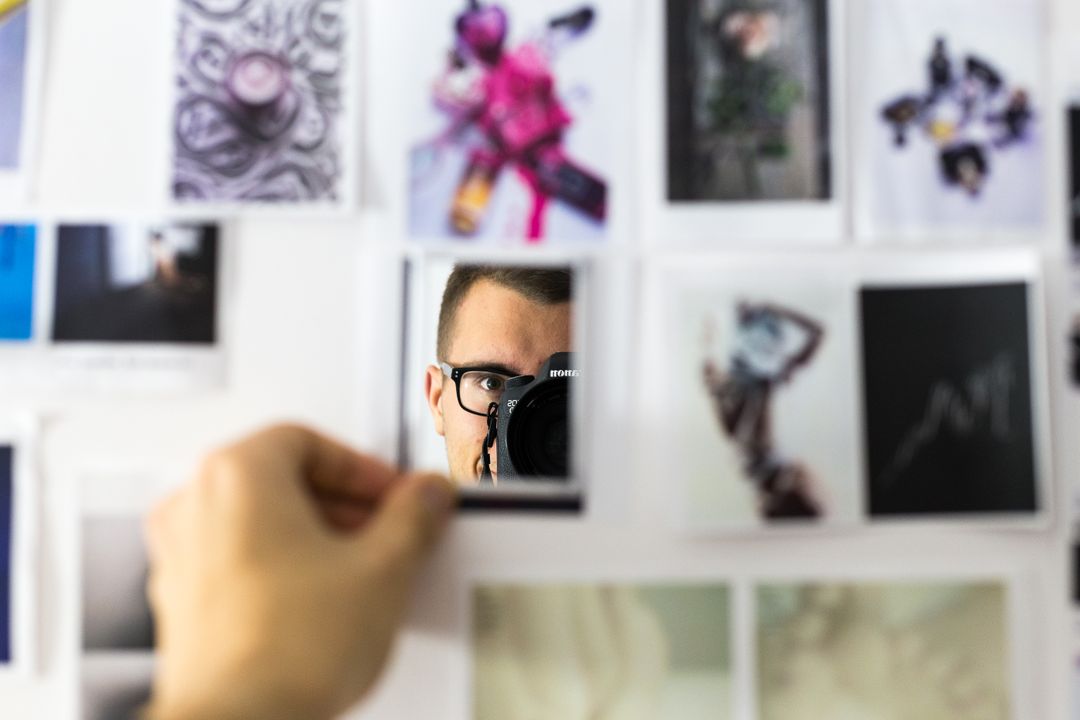 Image of a man taking photos in a mirror surrounded by a collage of images - How to make a beautiful mood board with free online tools - Image