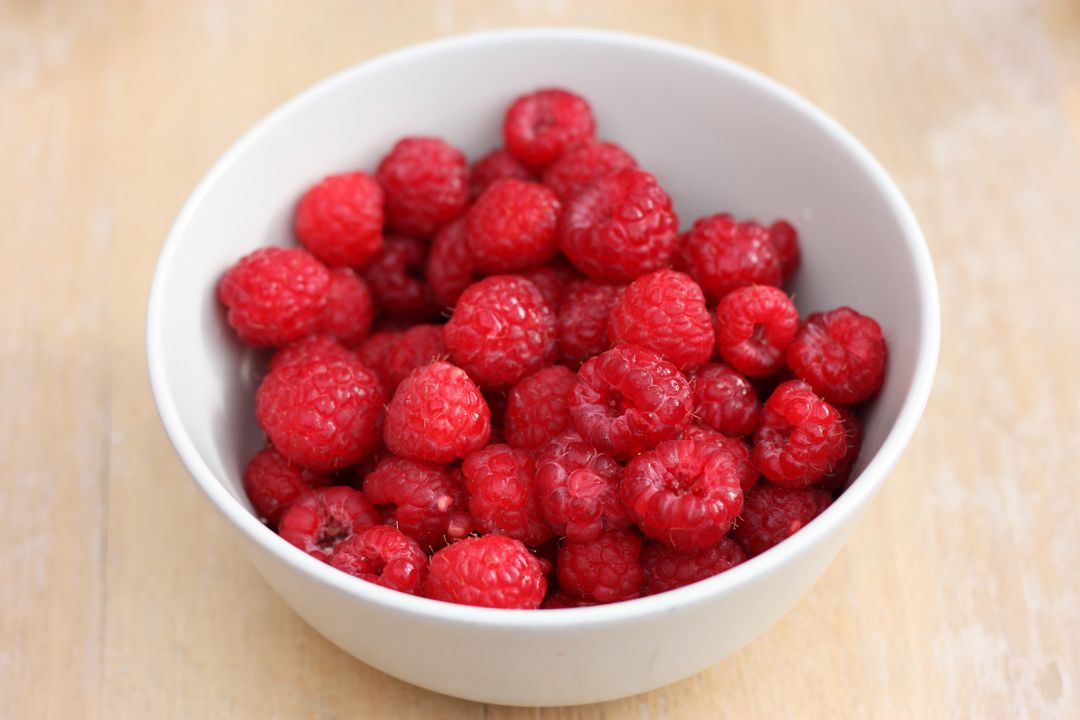 a bowl of raspberries - Free Images, Stock Photos and Pictures on Pikwizard.com