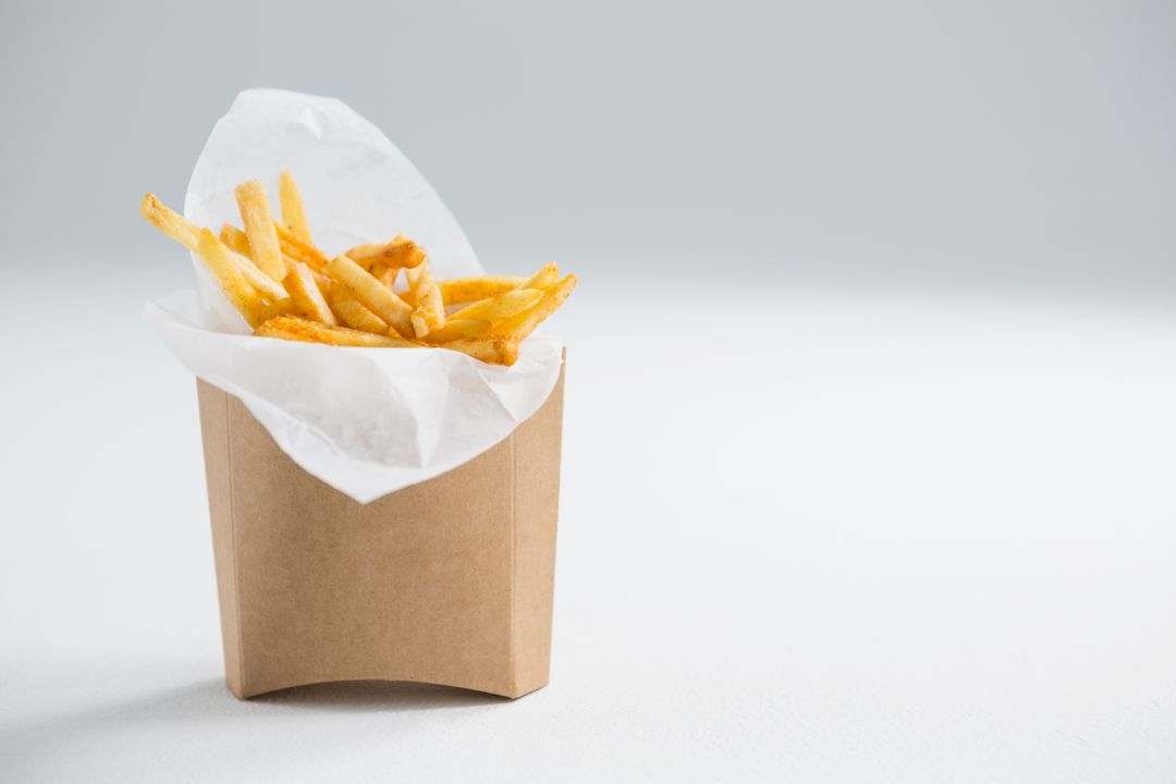 french fries in a paper bag Stock Photo