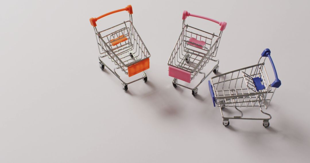 High angle view of three empty shopping trollies on white background with copy space - Free Images, Stock Photos and Pictures on Pikwizard.com