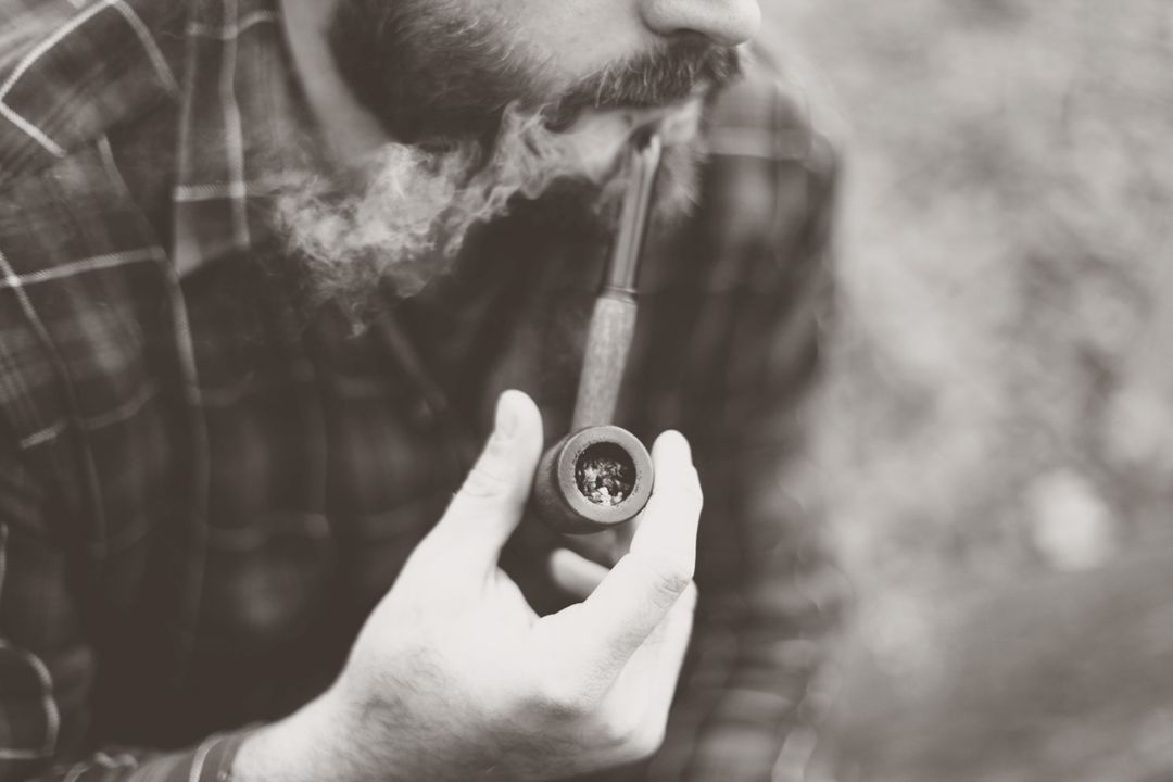 Grayscale Photo of Man Holding Tobacco Pipe - Free Images, Stock Photos and Pictures on Pikwizard.com