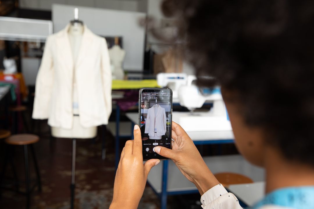 Image of a Woman Taking a Picture with her Smartphone of her Fashion Work