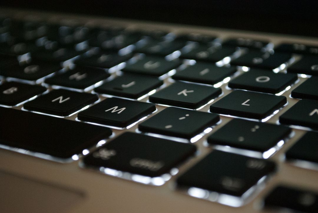 Close up image of a black keyboard of a laptop - Expert online marketing tips to improve your digital strategy and make more money - Image