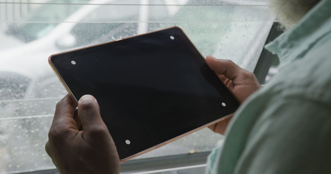 Image of african american senior man using tablet with black screen - Free Images, Stock Photos and Pictures on Pikwizard.com