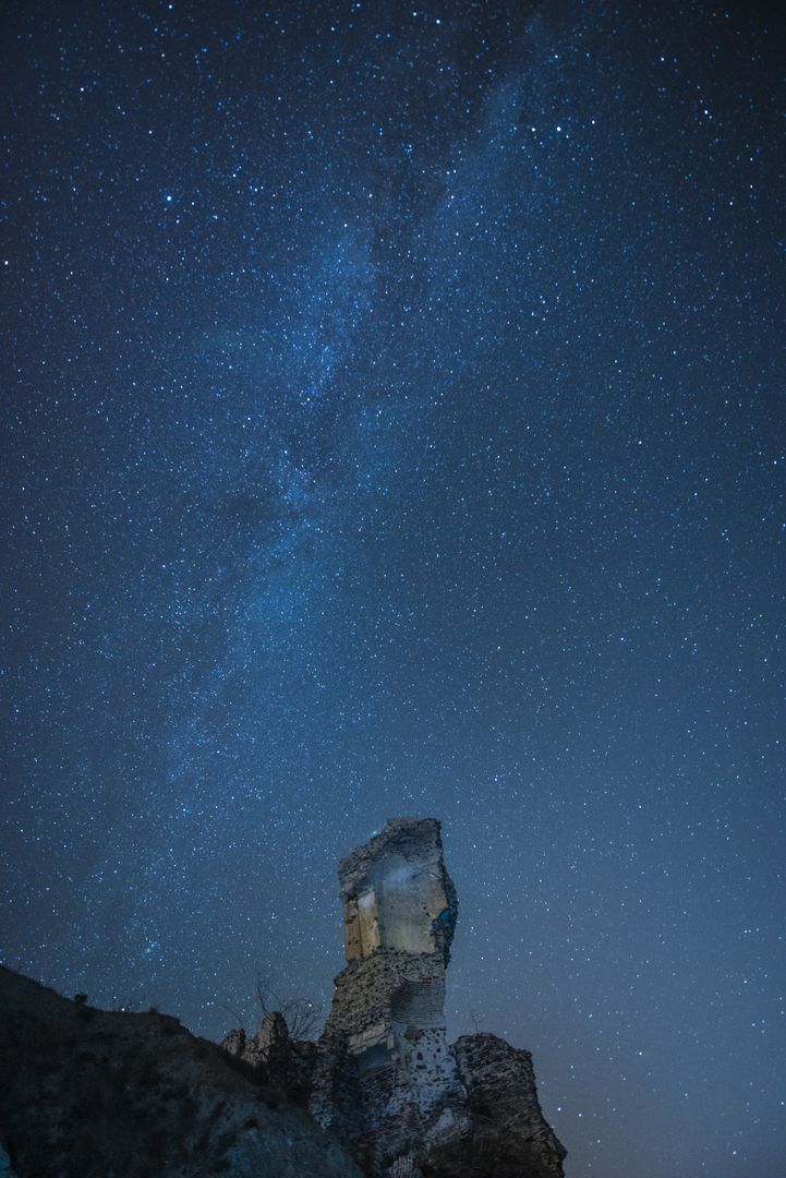 a rock formation under the stars - Free Images, Stock Photos and Pictures on Pikwizard.com