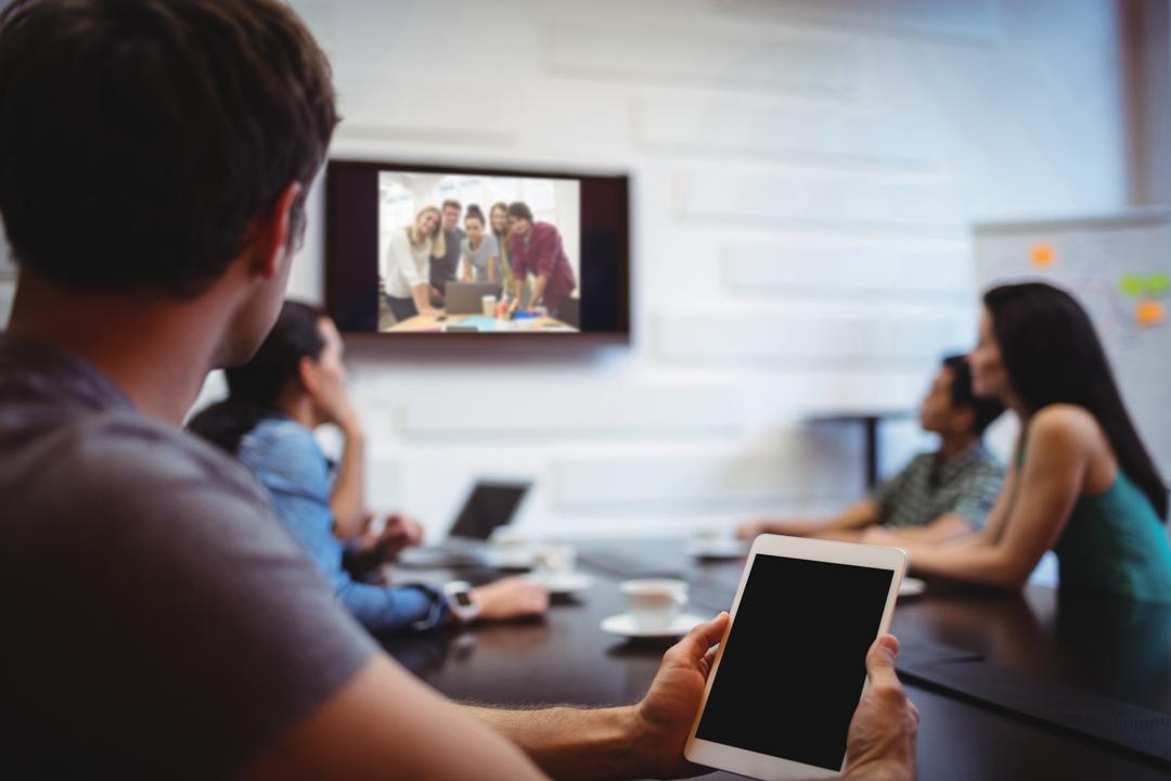 Image of people having a business video conference - Tips on creating actionable content on social media - Image