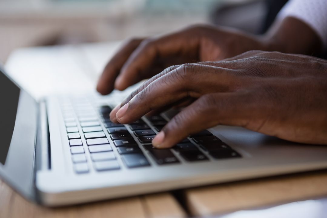 Man typing on a laptop keyboard - How to create engaging content for blogs - Image