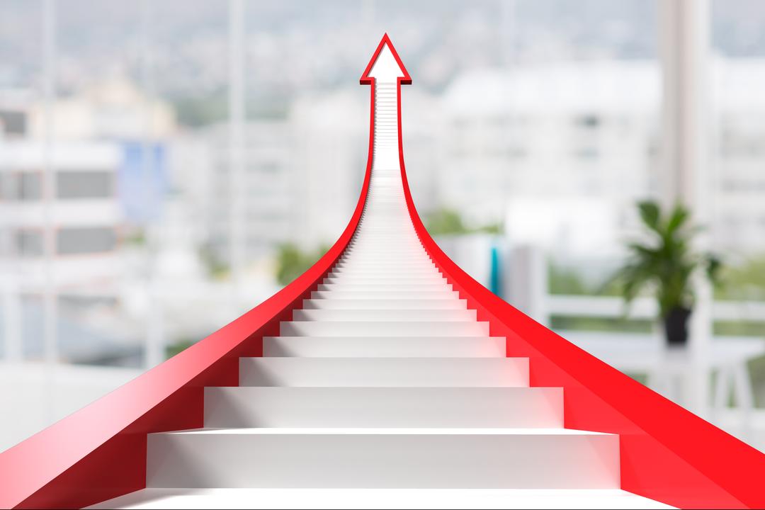 Stairs going upin the shape of an arrow with blurred office background