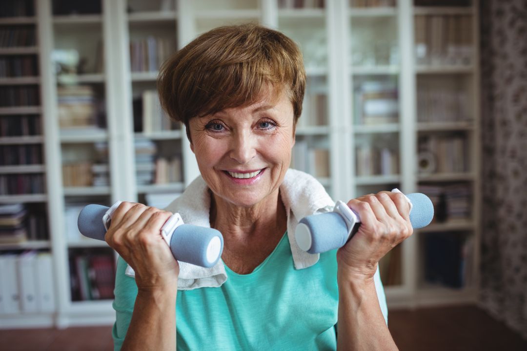 Senior woman exercising with dumbbells from Pikwizard