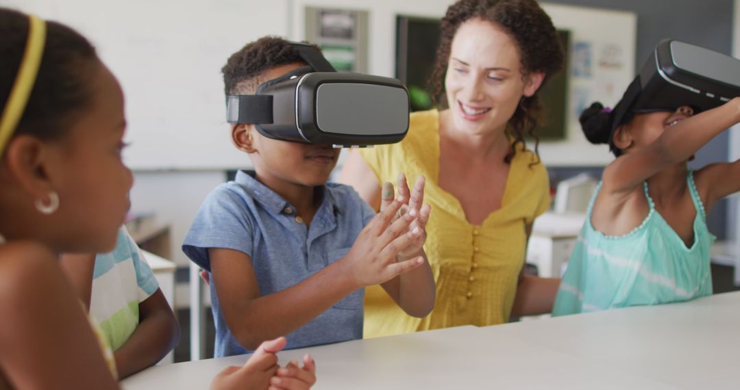 Image of happy caucasian female teacher and african american pupils wearing vr headsets - Free Images, Stock Photos and Pictures on Pikwizard.com