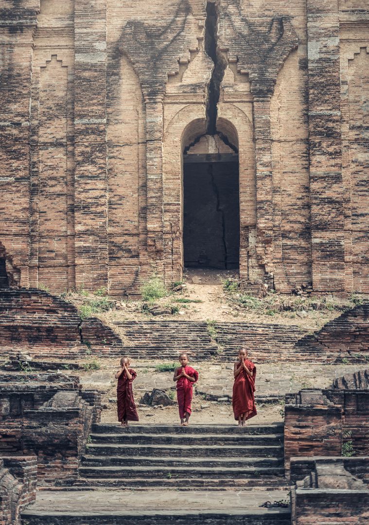 three monks walking down the steps of an ancient building - Free Images, Stock Photos and Pictures on Pikwizard.com