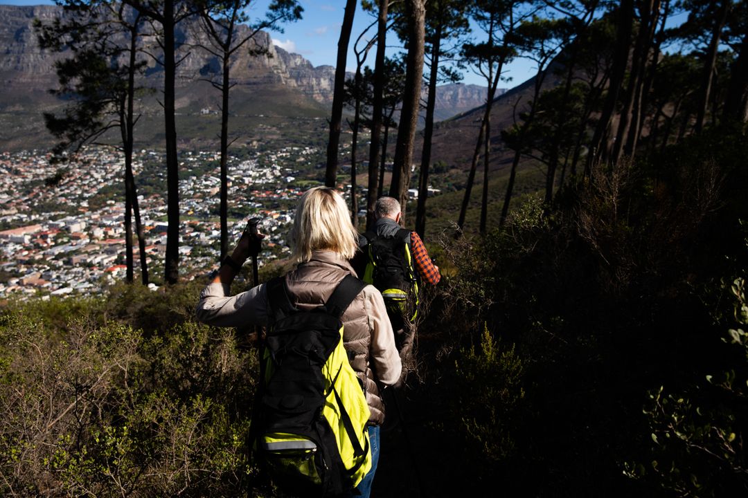 Couple hiking in a forest - Essential steps to start a lifestyle blog and be successful - Image