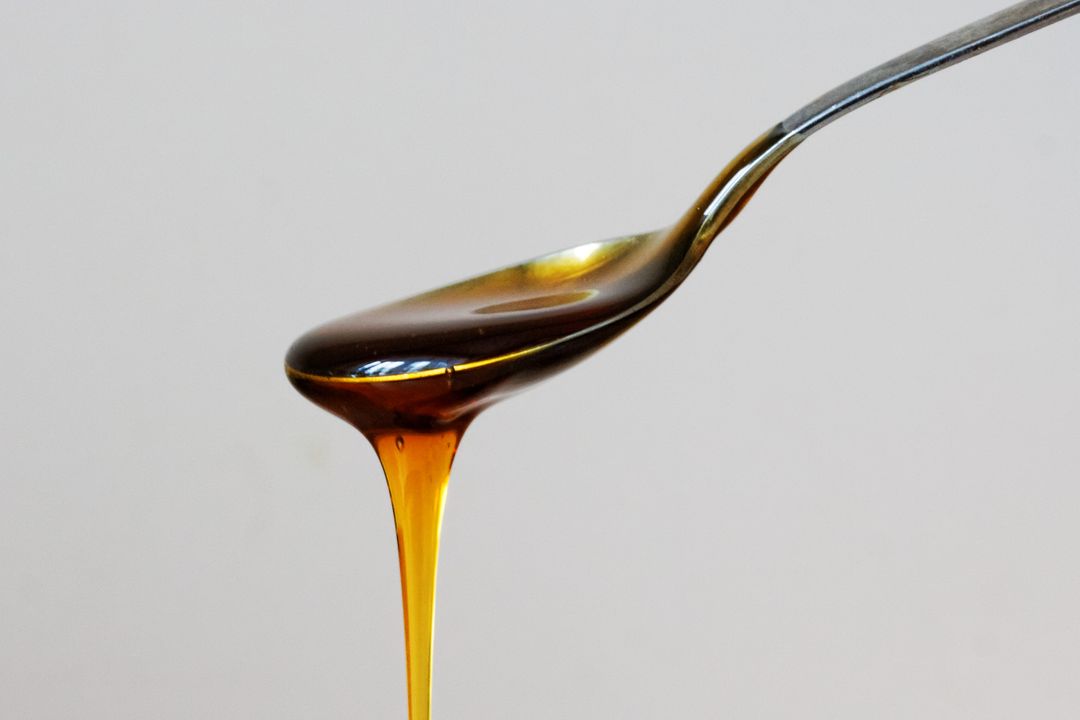 a spoon with honey - Free Images, Stock Photos and Pictures on Pikwizard.com