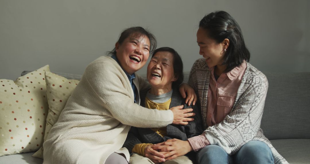 Smiling senior asian woman with two adult daughter and granddaughter embracing - Free Images, Stock Photos and Pictures on Pikwizard.com