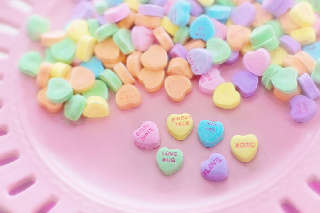 a pink plate with candy hearts - Free Images, Stock Photos and Pictures on Pikwizard.com