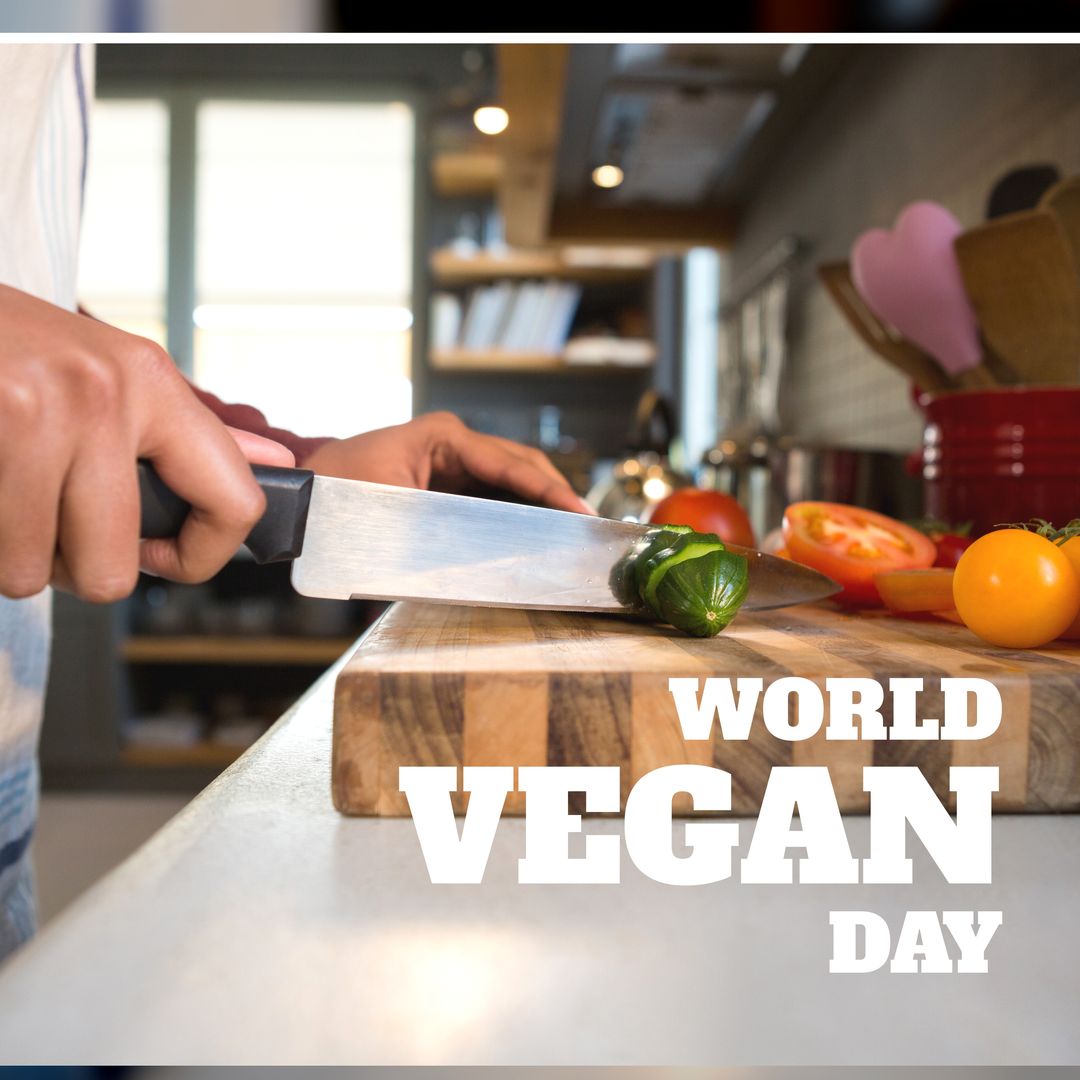 Composition of world vegan day text with caucasian man cooking in kitchen - Download Free Stock Templates Pikwizard.com