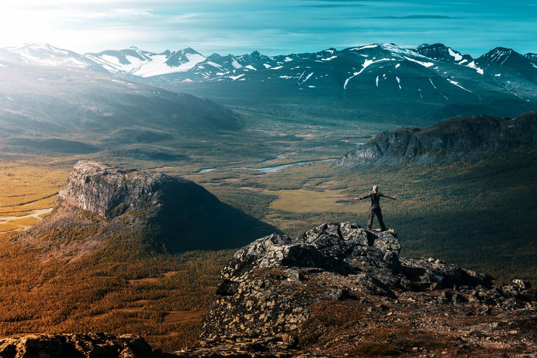 a man standing on a mountain top - Free Images, Stock Photos and Pictures on Pikwizard.com