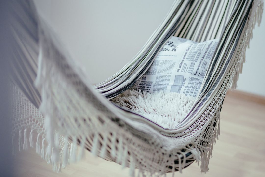 a hammock with a newspaper - Free Images, Stock Photos and Pictures on Pikwizard.com