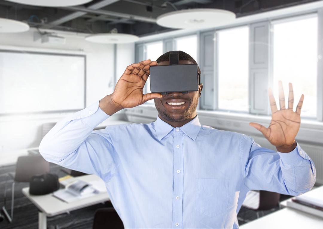 Man using virtual reality headset in office - Free Images, Stock Photos and Pictures on Pikwizard.com