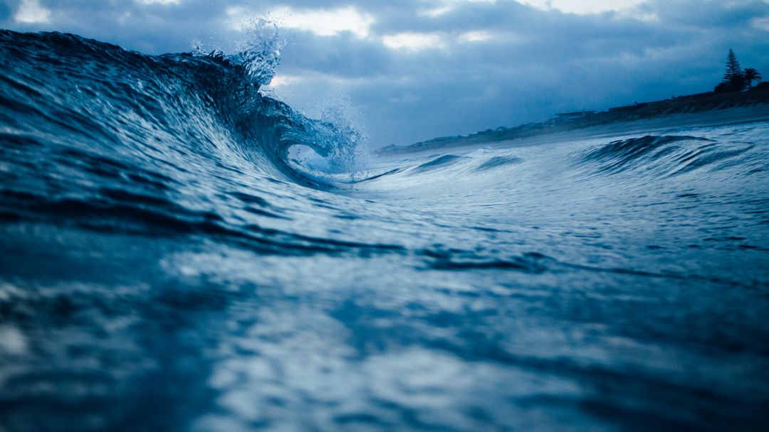 a wave breaking on the ocean - Free Images, Stock Photos and Pictures on Pikwizard.com