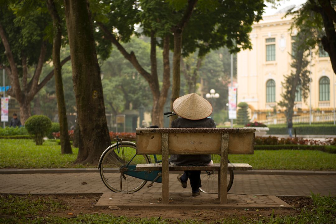 a person sitting on a bench - Free Images, Stock Photos and Pictures on Pikwizard.com