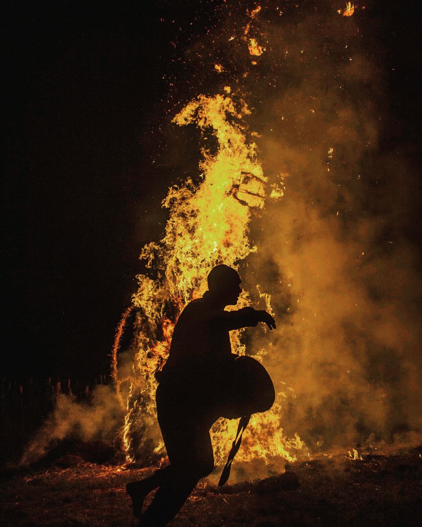 a person that is standing next to a bonfire - Free Images, Stock Photos and Pictures on Pikwizard.com