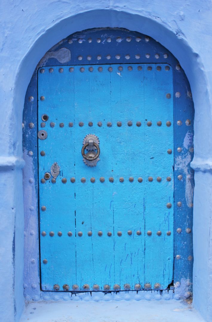 a blue door with rivets - Free Images, Stock Photos and Pictures on Pikwizard.com
