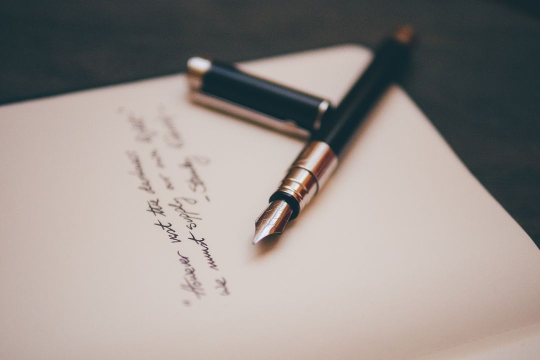 Image of a pen on a notebook page
