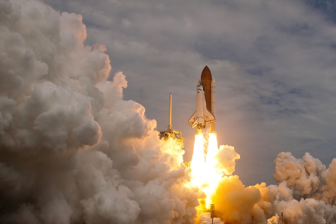 a space shuttle taking off from Pikwizard