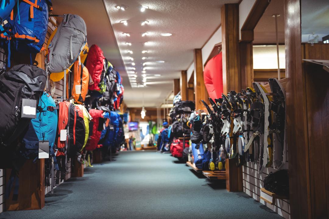 Interior of a sportswear store with backpacks and equipment