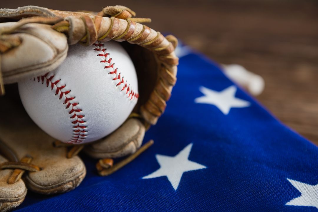 Baseball and gloves on an American flag - Free Images, Stock Photos and Pictures on Pikwizard.com