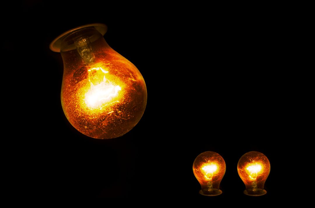 Image of Three Bulbs and a Black Background